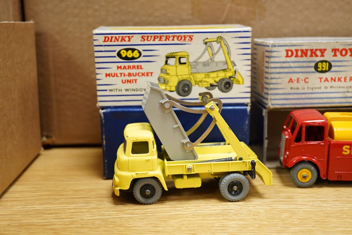 Five boxed Dinky Toys and Supertoys; Bedford Articulated Lorry in yellow (521), Leyland Cement Wagon (933), AEC tanker (991), Plymouth USA taxi (265) and Marrel Multi-Bucket Unit (966)